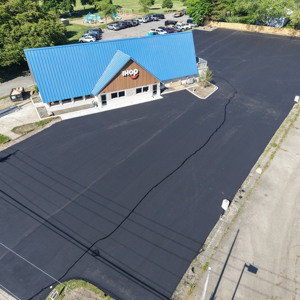 Commercial Paving dji_fly_20260603_163400_0258_1780524113740_photo In-progress parking lot for iHop before the lines are drawn.